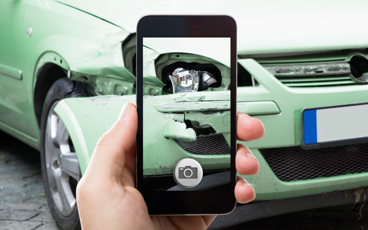 Person Taking Photo Of Car Accident